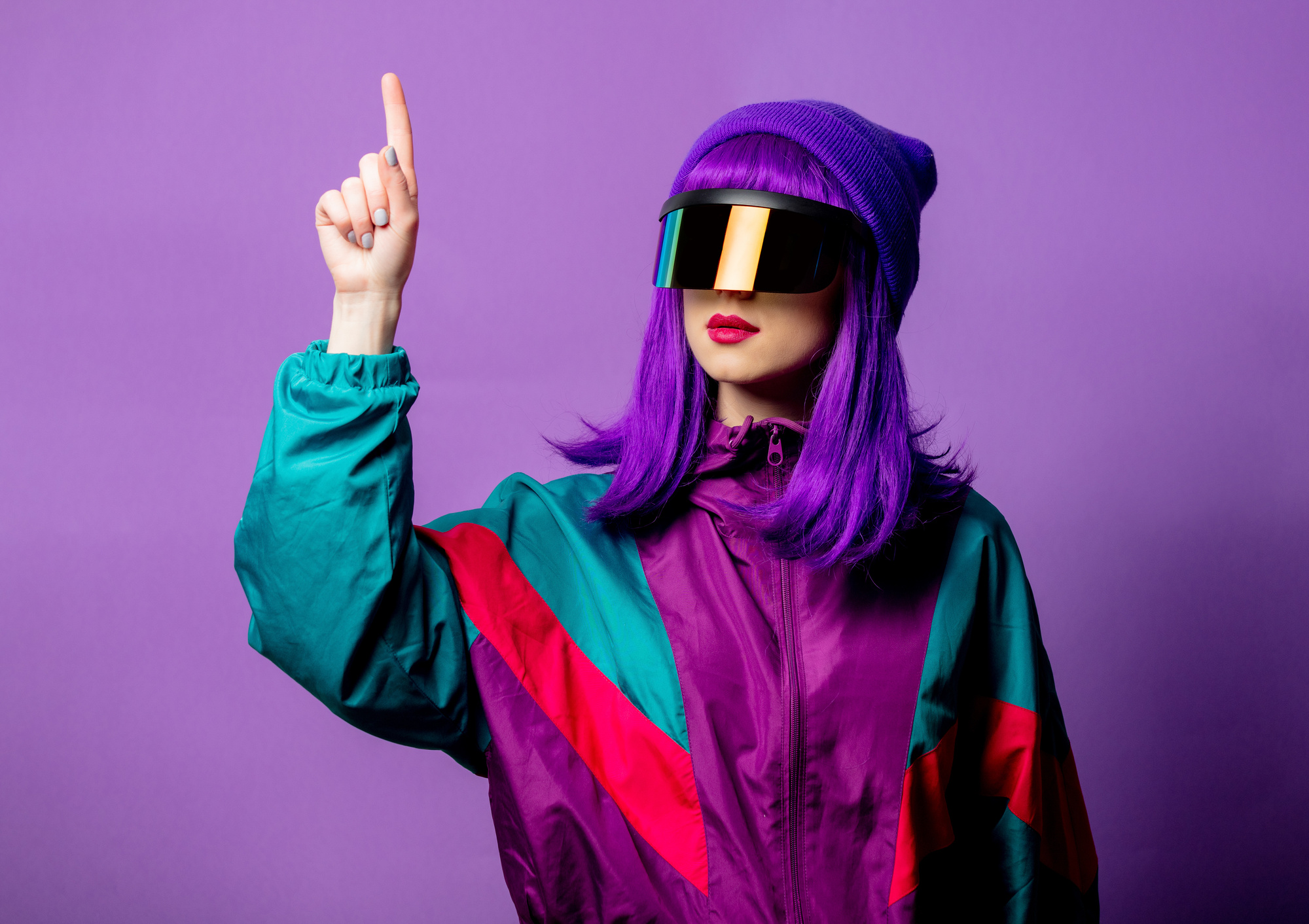 Style woman in VR glasses and 80s tracksuit on violet background